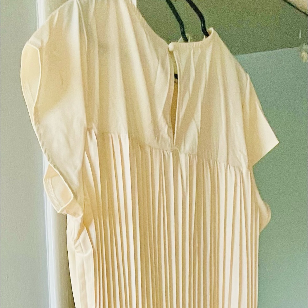 Ankle-length corded pleated dress.